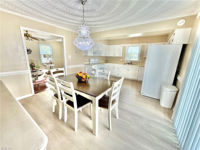 1736 Lockard Ave, Chesapeake, VA 23320 - dining area with light wood-type flooring, plenty of natural light, crown molding, and a chandelier