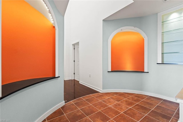 3738 Sandpiper Rd Unit 413, Virginia Beach, VA 23456 - unfurnished bedroom with baseboards and arched walkways