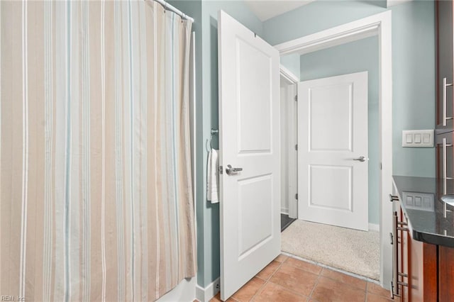 3738 Sandpiper Rd Unit 413, Virginia Beach, VA 23456 - full bathroom with tile patterned flooring, curtained shower, and baseboards