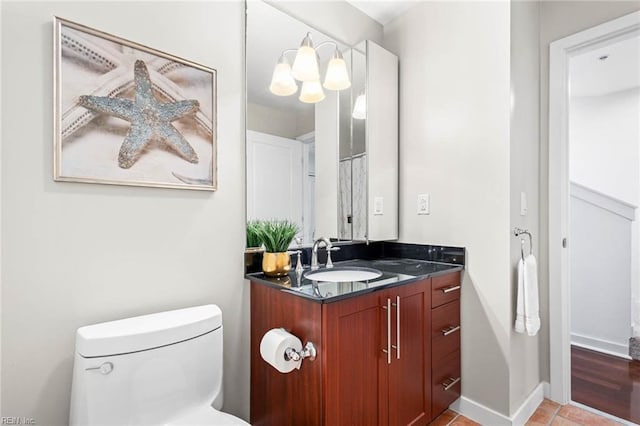 3738 Sandpiper Rd Unit 413, Virginia Beach, VA 23456 - full bathroom featuring vanity, toilet, and baseboards