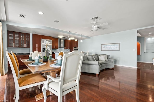 3738 Sandpiper Rd Unit 413, Virginia Beach, VA 23456 - dining room with ceiling fan, baseboards, dark wood finished floors, recessed lighting, and arched walkways
