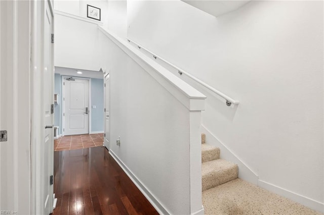 3738 Sandpiper Rd Unit 413, Virginia Beach, VA 23456 - stairway featuring baseboards and wood-type flooring