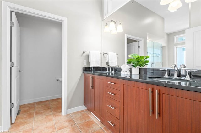 3738 Sandpiper Rd Unit 413, Virginia Beach, VA 23456 - full bathroom featuring double vanity, tile patterned floors, baseboards, a chandelier, and a shower with door