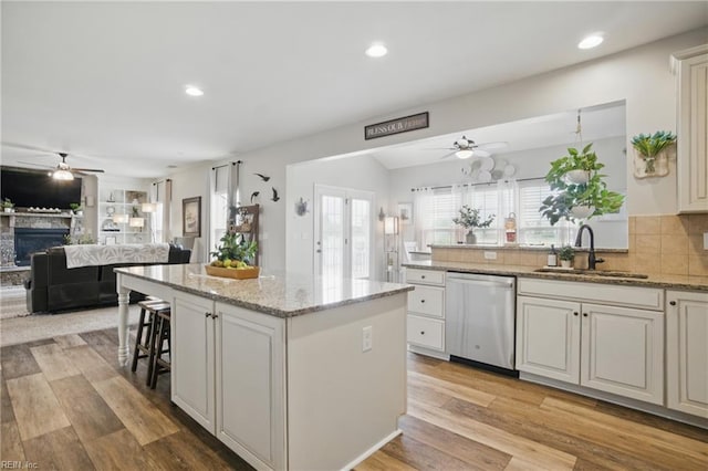 2685 Robert Monette Ln, Virginia Beach, VA 23456 - kitchen featuring dishwasher, a ceiling fan, a sink, open floor plan, and recessed lighting