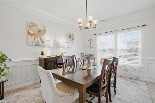 2685 Robert Monette Ln, Virginia Beach, VA 23456 - dining space featuring a chandelier, ornamental molding, wainscoting, light carpet, and a decorative wall