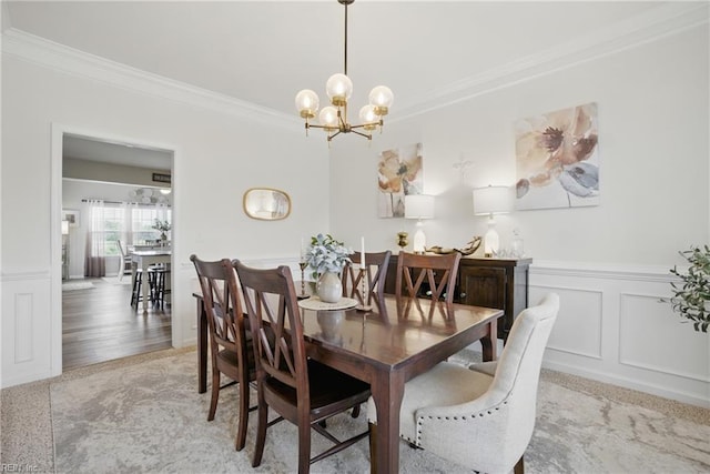 2685 Robert Monette Ln, Virginia Beach, VA 23456 - dining room featuring ornamental molding, a chandelier, wainscoting, and a decorative wall