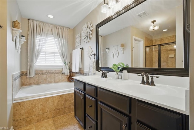 2685 Robert Monette Ln, Virginia Beach, VA 23456 - bathroom with tile patterned flooring, a bath, double vanity, a stall shower, and recessed lighting