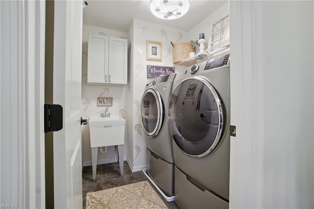 2685 Robert Monette Ln, Virginia Beach, VA 23456 - laundry area with independent washer and dryer, cabinet space, dark tile patterned floors, and baseboards
