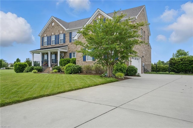 2685 Robert Monette Ln, Virginia Beach, VA 23456 - view of front of property featuring driveway, brick siding, an attached garage, and a porch