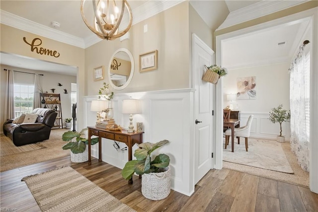 2685 Robert Monette Ln, Virginia Beach, VA 23456 - entryway featuring a decorative wall, a chandelier, wood finished floors, a wainscoted wall, and ornamental molding