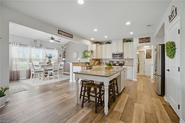 2685 Robert Monette Ln, Virginia Beach, VA 23456 - kitchen with appliances with stainless steel finishes, a ceiling fan, light wood-style flooring, a sink, and recessed lighting