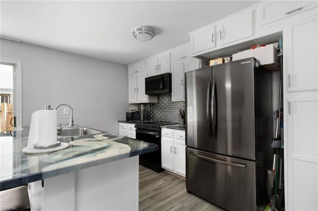 686 Aylesbury Dr, Virginia Beach, VA 23462 - kitchen with black appliances, a sink, decorative backsplash, and white cabinets