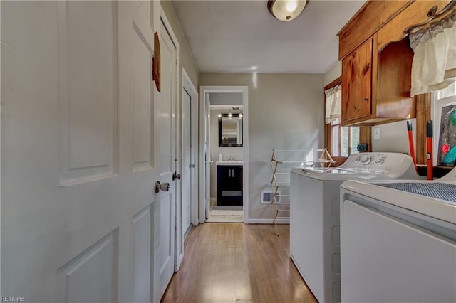 405 Bartell Dr, Chesapeake, VA 23322 - laundry room featuring cabinet space, washing machine and dryer, light wood-type flooring, and baseboards