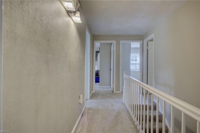 405 Bartell Dr, Chesapeake, VA 23322 - hall featuring light carpet, baseboards, and an upstairs landing