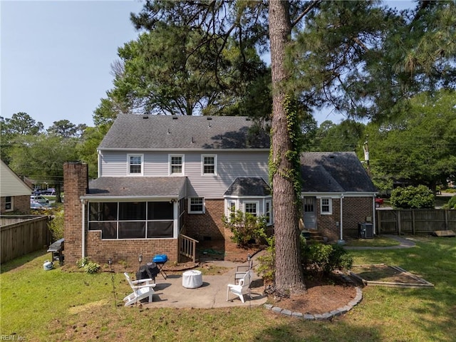 405 Bartell Dr, Chesapeake, VA 23322 - rear view of house featuring a sunroom, a patio area, brick siding, central air condition unit, and a chimney