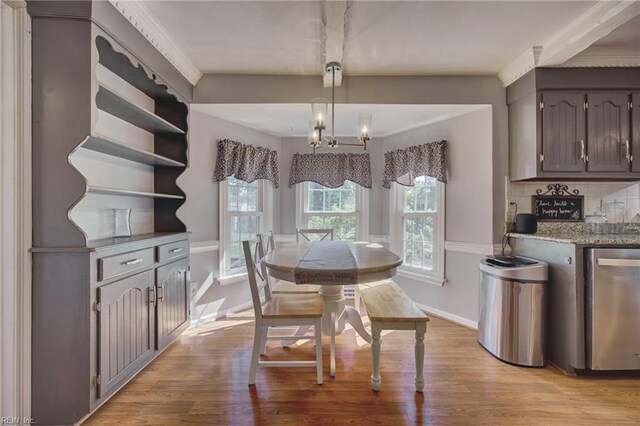 405 Bartell Dr, Chesapeake, VA 23322 - dining area featuring light wood-style floors, baseboards, and bar area