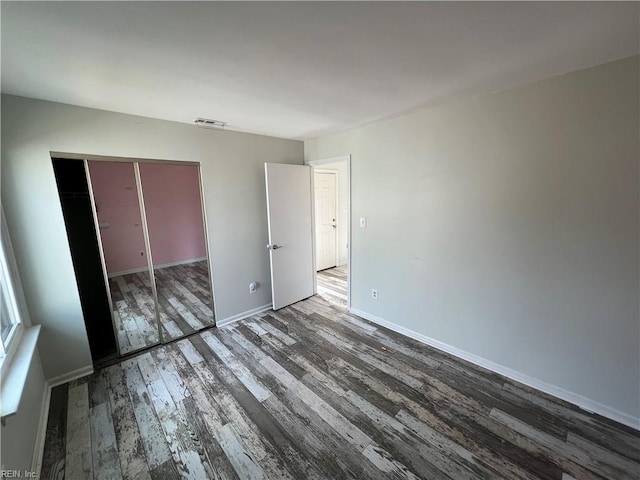419 Marsh Duck Way, Virginia Beach, VA 23451 - unfurnished bedroom with wood finished floors, baseboards, and a closet