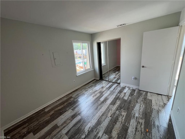 419 Marsh Duck Way, Virginia Beach, VA 23451 - unfurnished bedroom with wood finished floors, baseboards, and a closet