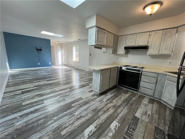 419 Marsh Duck Way, Virginia Beach, VA 23451 - kitchen featuring a skylight, range, light countertops, and dark wood-style floors