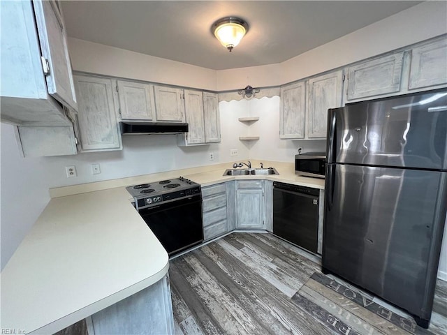 419 Marsh Duck Way, Virginia Beach, VA 23451 - kitchen with appliances with stainless steel finishes, under cabinet range hood, a sink, light countertops, and dark wood-style flooring