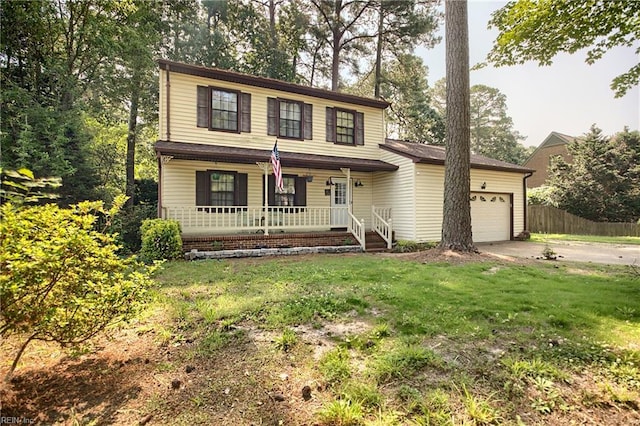 1 Smith St, Poquoson, VA 23662 - traditional home featuring covered porch, an attached garage, and driveway