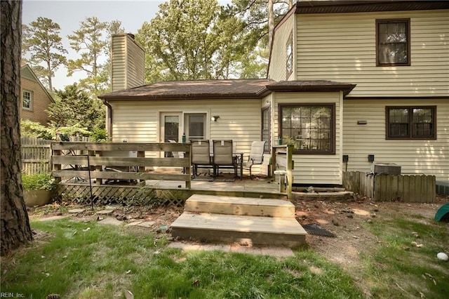 1 Smith St, Poquoson, VA 23662 - back of property featuring a deck and a chimney