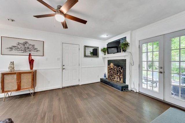 401 Kings Point Rd, Virginia Beach, VA 23452 - unfurnished living room featuring ornamental molding, a ceiling fan, wood finished floors, a brick fireplace, and french doors
