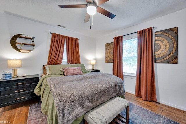 401 Kings Point Rd, Virginia Beach, VA 23452 - bedroom with wood finished floors, a ceiling fan, and baseboards