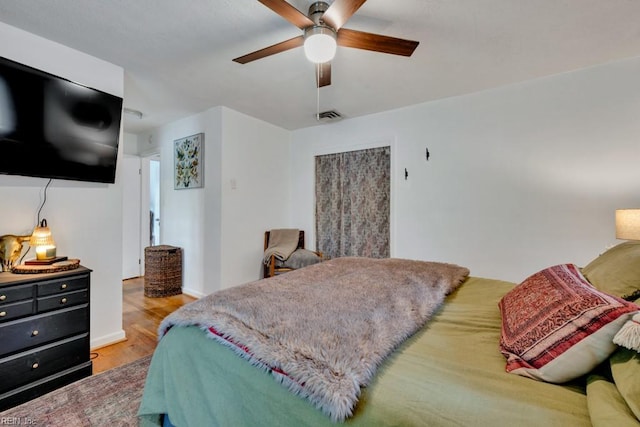 401 Kings Point Rd, Virginia Beach, VA 23452 - bedroom featuring wood finished floors, a ceiling fan, and baseboards