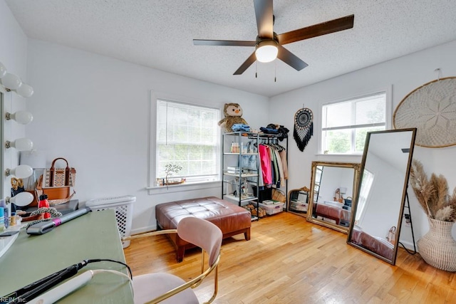 401 Kings Point Rd, Virginia Beach, VA 23452 - bedroom featuring a textured ceiling, wood finished floors, and a ceiling fan