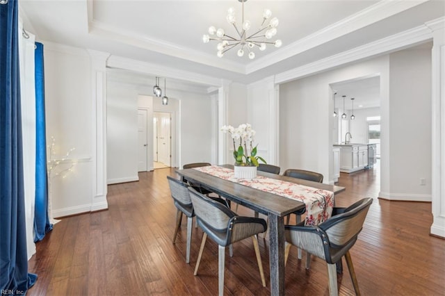 1652 Teton Ct, Chesapeake, VA 23320 - dining space with decorative columns, a chandelier, dark wood-style floors, a raised ceiling, and ornamental molding