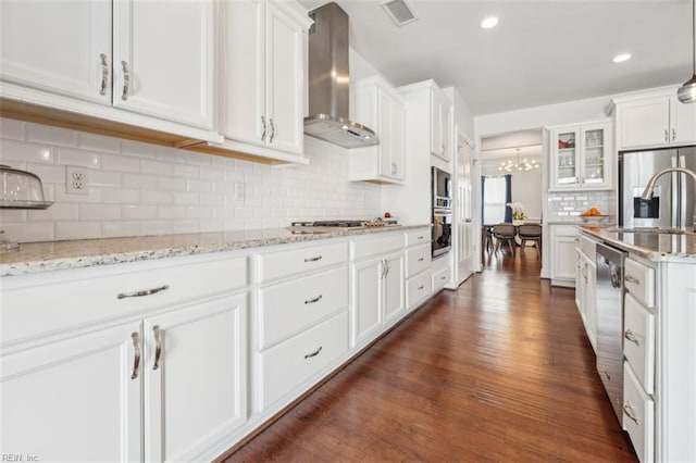 1652 Teton Ct, Chesapeake, VA 23320 - kitchen with wall chimney exhaust hood, appliances with stainless steel finishes, dark wood-style floors, white cabinetry, and recessed lighting