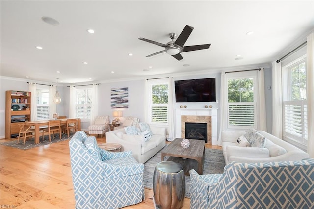 120 55th 1/2 St, Virginia Beach, VA 23451 - living area featuring light wood finished floors, recessed lighting, a glass covered fireplace, crown molding, and ceiling fan
