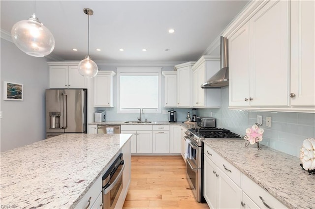 120 55th 1/2 St, Virginia Beach, VA 23451 - kitchen featuring appliances with stainless steel finishes, light wood-type flooring, a sink, white cabinets, and crown molding