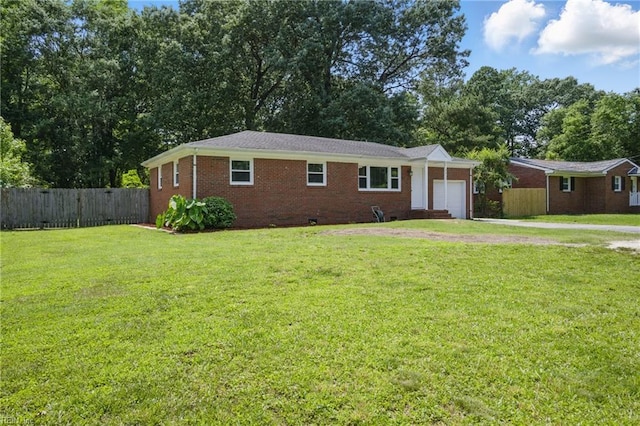 2613 Cedar Rd, Chesapeake, VA 23323 - single story home featuring a garage, concrete driveway, brick siding, and view of scattered trees
