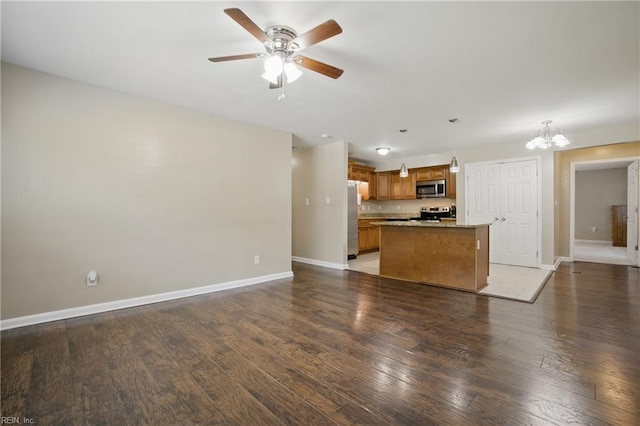2613 Cedar Rd, Chesapeake, VA 23323 - unfurnished living room with a ceiling fan, a chandelier, baseboards, and wood finished floors