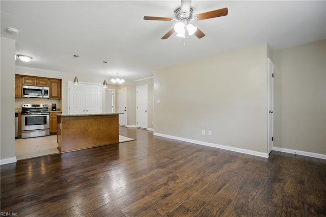 2613 Cedar Rd, Chesapeake, VA 23323 - unfurnished living room featuring ceiling fan, wood finished floors, and baseboards