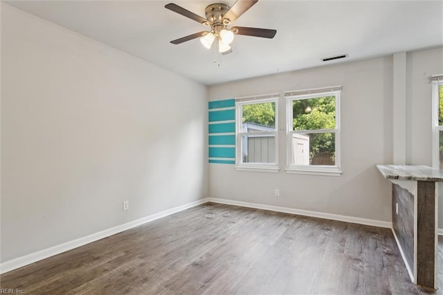 3054 Comte Ct, Virginia Beach, VA 23453 - empty room with healthy amount of natural light, wood finished floors, baseboards, and a ceiling fan