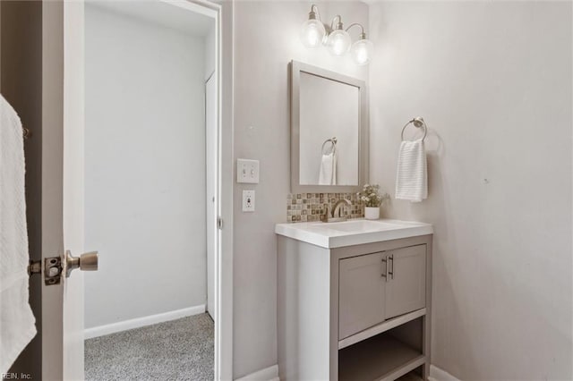 3054 Comte Ct, Virginia Beach, VA 23453 - bathroom with vanity, baseboards, and backsplash