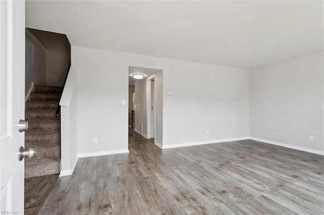 3054 Comte Ct, Virginia Beach, VA 23453 - unfurnished room with wood finished floors, stairs, and baseboards
