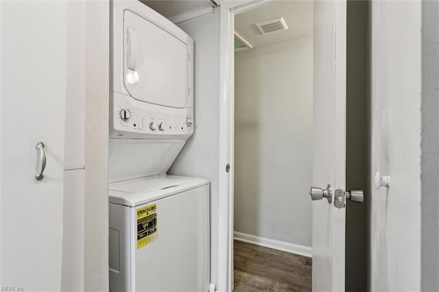 3054 Comte Ct, Virginia Beach, VA 23453 - laundry room featuring stacked washer and clothes dryer, wood finished floors, and baseboards