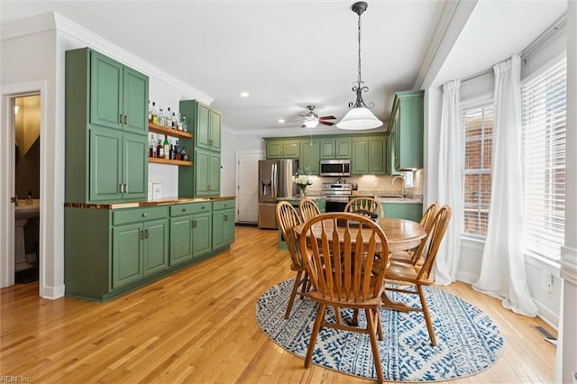 5891 Chaucer Dr, Providence Forge, VA 23140 - dining area with a ceiling fan, ornamental molding, light wood finished floors, recessed lighting, and baseboards