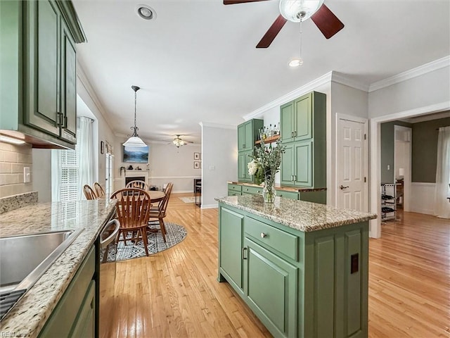 5891 Chaucer Dr, Providence Forge, VA 23140 - kitchen with green cabinets, ceiling fan, light wood-type flooring, stainless steel dishwasher, and ornamental molding