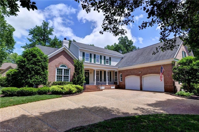 200 Cruden Bay, Williamsburg, VA 23188 - view of front of house with a porch, a garage, brick siding, and driveway