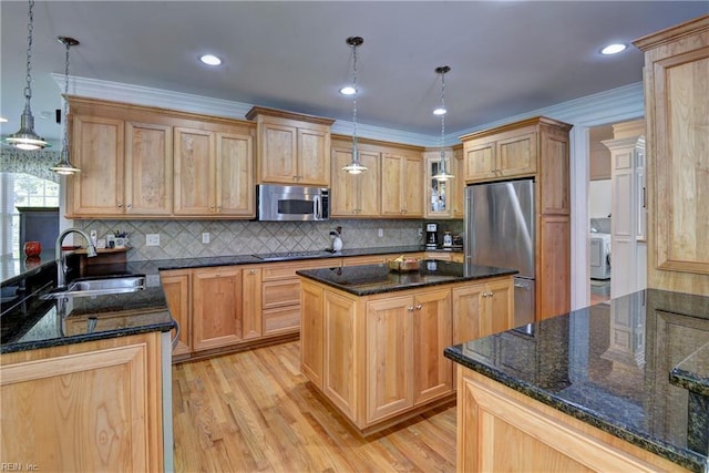 200 Cruden Bay, Williamsburg, VA 23188 - kitchen featuring stainless steel appliances, a sink, light wood finished floors, a center island, and tasteful backsplash