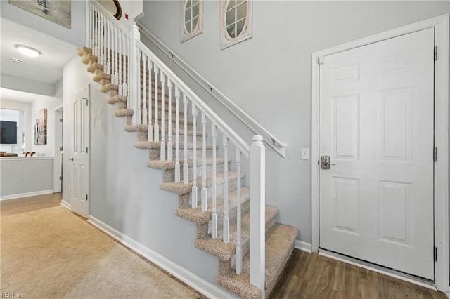 13435 Prince Andrew Trl, Carrollton, VA 23314 - stairs with baseboards and wood finished floors