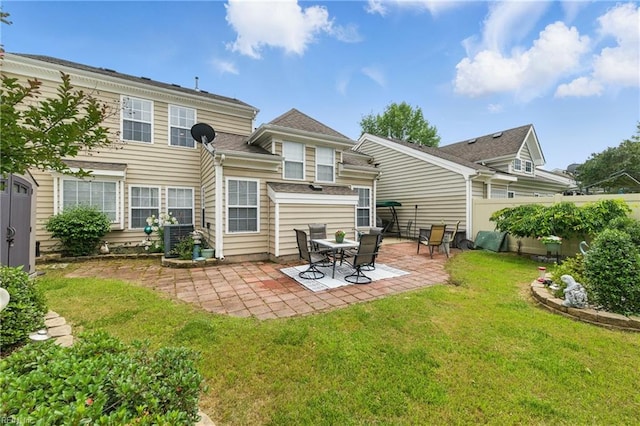 13435 Prince Andrew Trl, Carrollton, VA 23314 - rear view of house featuring a patio
