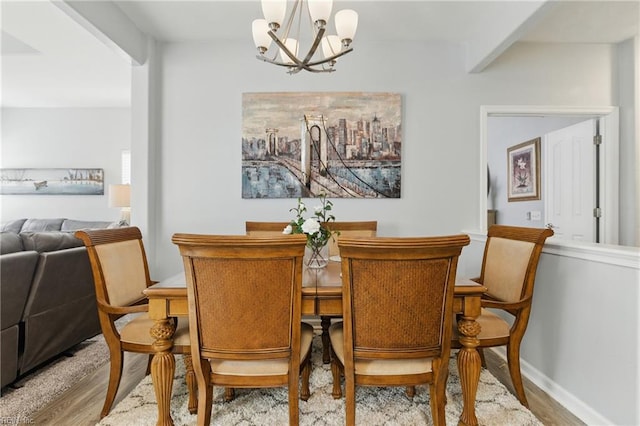 13435 Prince Andrew Trl, Carrollton, VA 23314 - dining room featuring a chandelier, wood finished floors, and baseboards