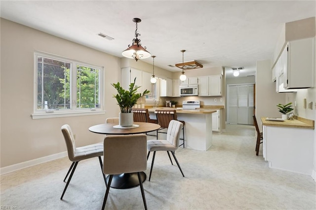 2438 Blue Castle Ct, Virginia Beach, VA 23454 - dining space featuring light colored carpet and baseboards