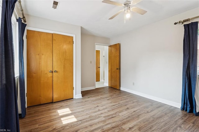 2438 Blue Castle Ct, Virginia Beach, VA 23454 - unfurnished bedroom featuring wood finished floors, baseboards, and a ceiling fan